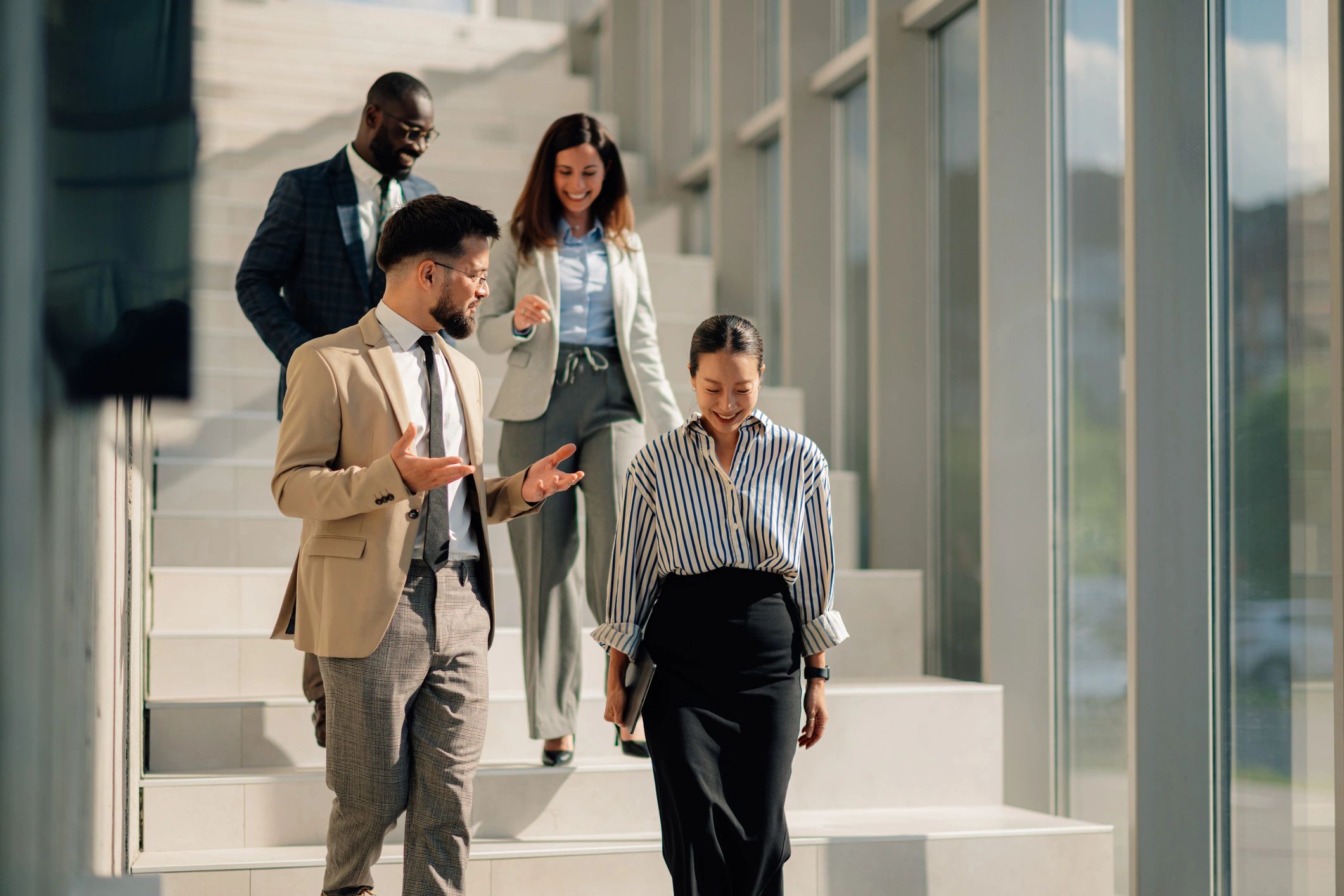 Business team walking through a modern office