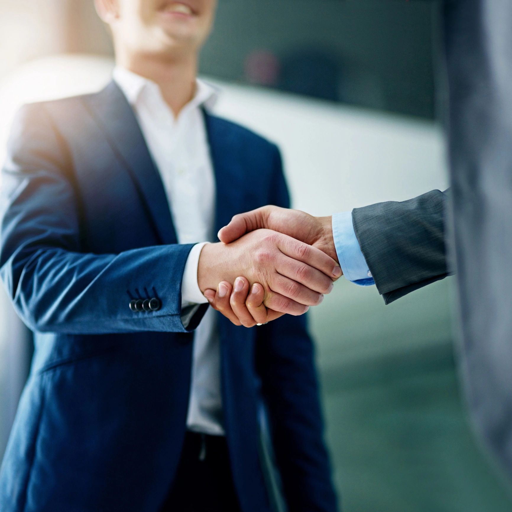 Business handshake representing order confirmation